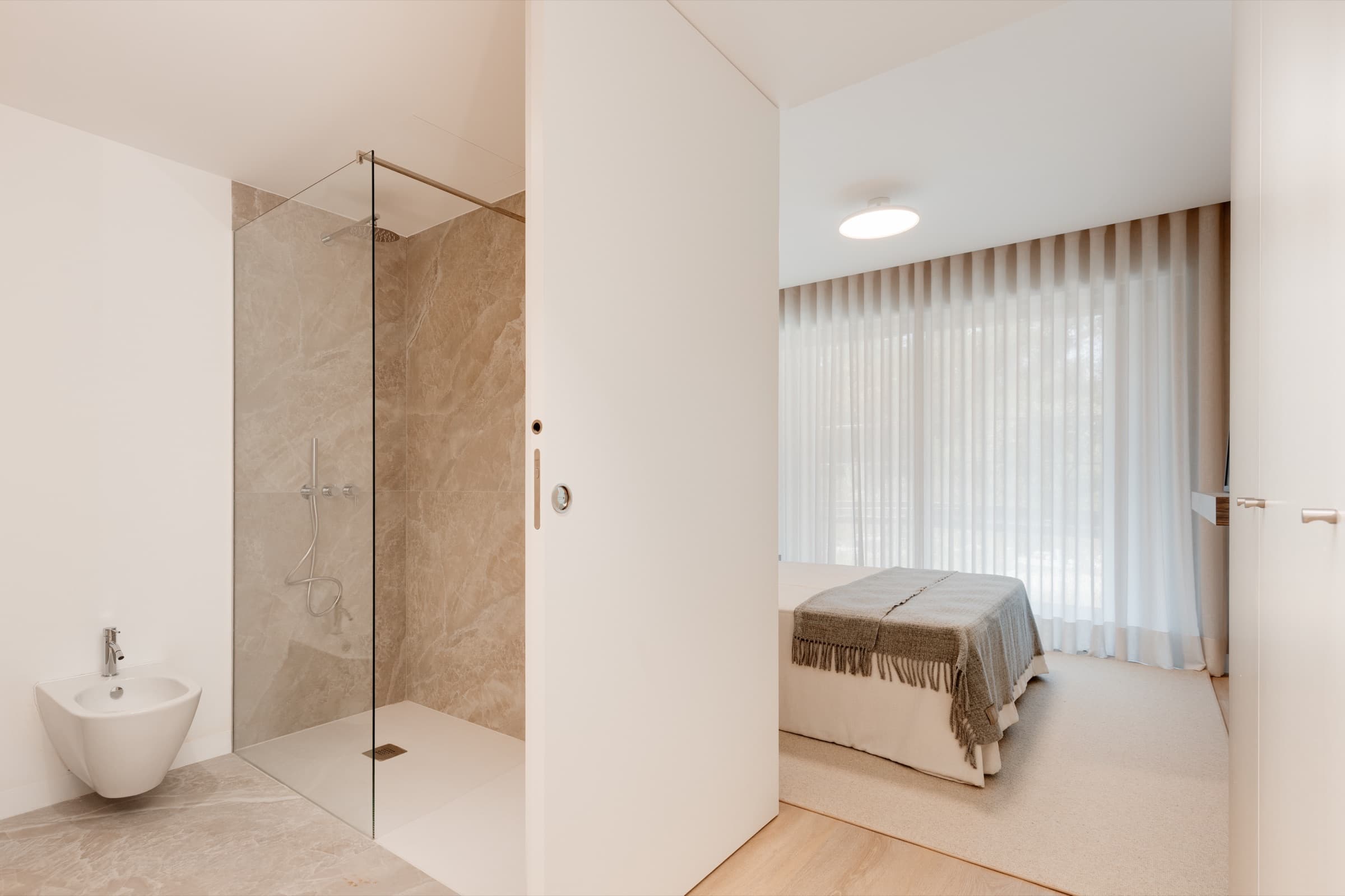 Shower — Rectified ceramic tile · frameless glass screen
